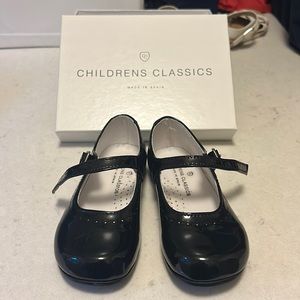 Children’s Classics black patent shoes.